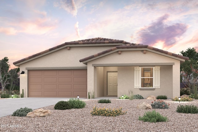 1648 W Posada St, Coolidge, AZ 85128 - view of front of house featuring a garage, stucco siding, and concrete driveway