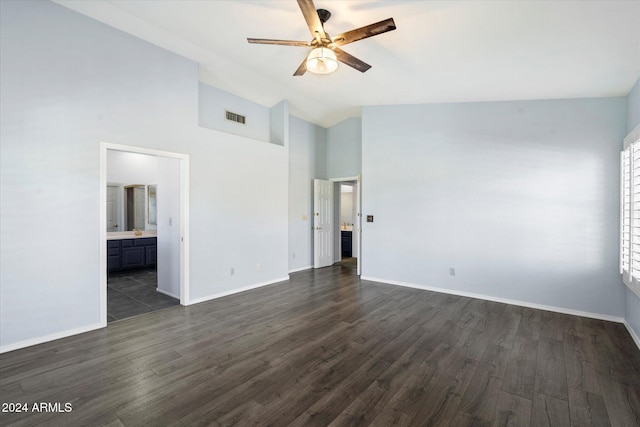 spare room with dark hardwood / wood-style flooring, high vaulted ceiling, and ceiling fan