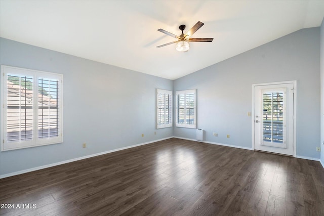 unfurnished room with ceiling fan, dark hardwood / wood-style flooring, and vaulted ceiling