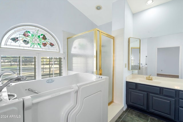 bathroom with tile patterned flooring, vanity, high vaulted ceiling, and independent shower and bath