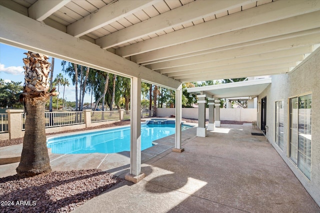 view of swimming pool with a patio