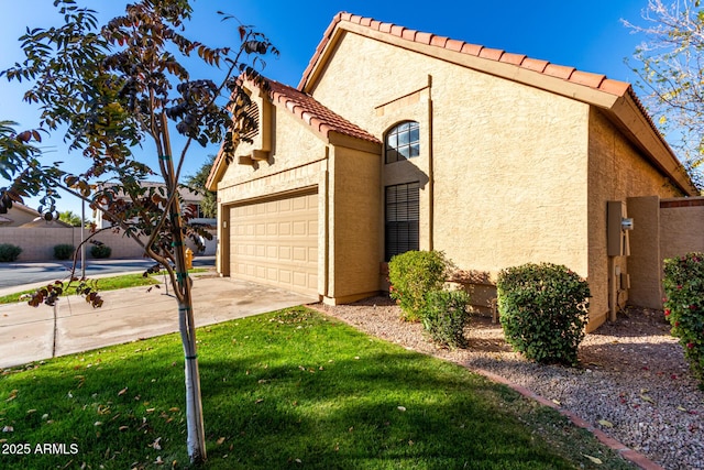 view of side of property featuring a garage