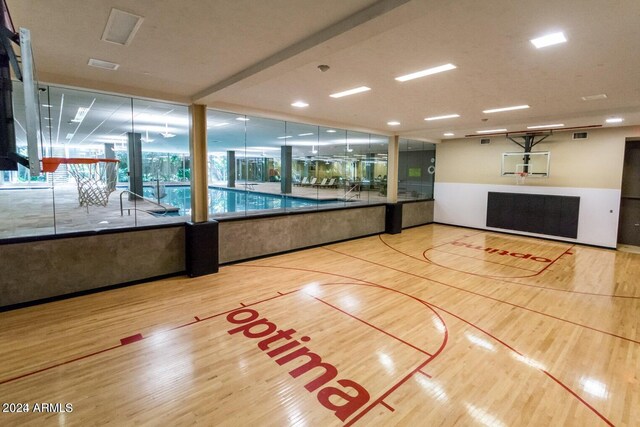 gym featuring light wood-type flooring