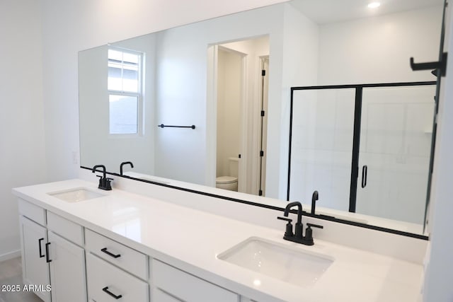 2482 W Rowel Rd, Phoenix, AZ 85085 - bathroom featuring toilet, double vanity, and a shower stall