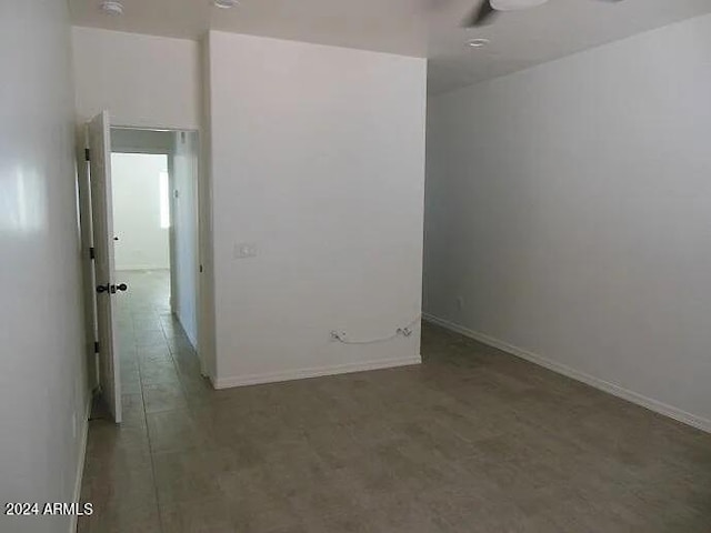 unfurnished room featuring ceiling fan