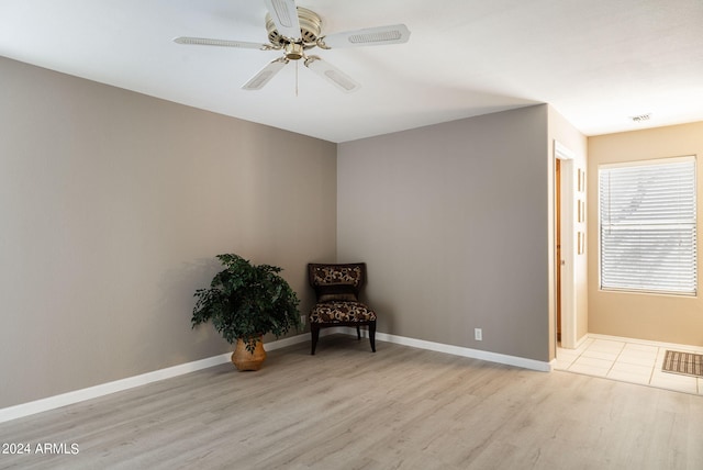 unfurnished room with ceiling fan and light hardwood / wood-style flooring