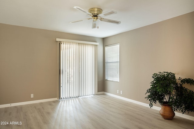 spare room with ceiling fan and light hardwood / wood-style floors