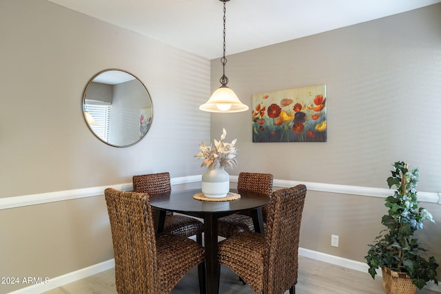 dining room with light wood-type flooring