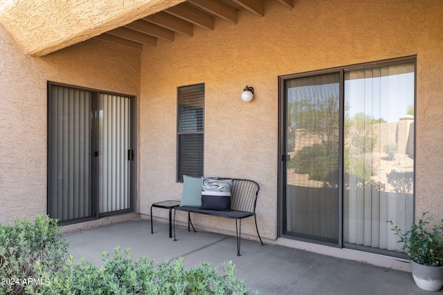 entrance to property featuring a patio area