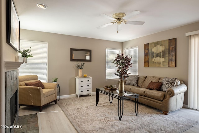 living room with hardwood / wood-style flooring and ceiling fan