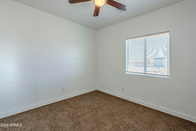 spare room with carpet and ceiling fan