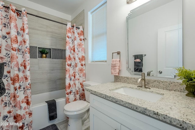 full bathroom with vanity, toilet, and shower / bathtub combination with curtain