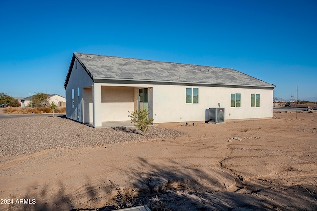 back of property featuring central AC unit