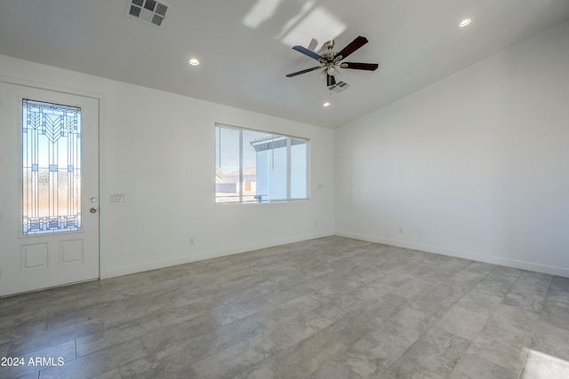 interior space with ceiling fan, a healthy amount of sunlight, and lofted ceiling