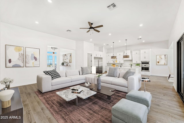 13930 E Barwick Dr, Scottsdale, AZ 85262 - living area featuring visible vents, recessed lighting, light wood-type flooring, and a ceiling fan