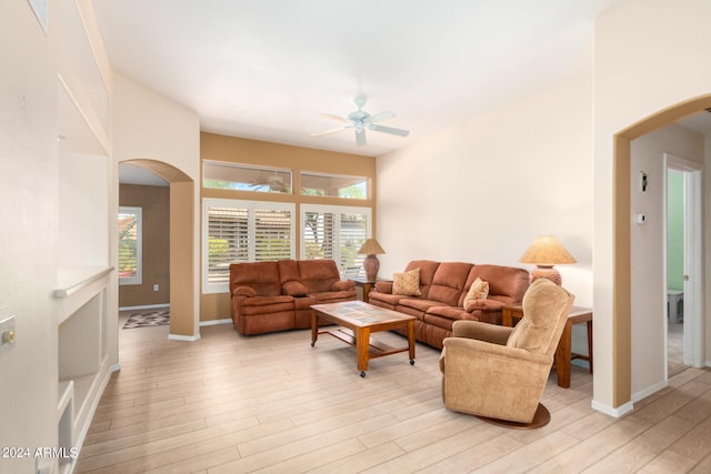 living room featuring ceiling fan and light hardwood / wood-style flooring