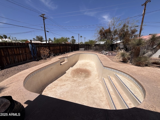 201 E 2nd Ave, Ajo, AZ 85321 - view of swimming pool featuring a fenced backyard