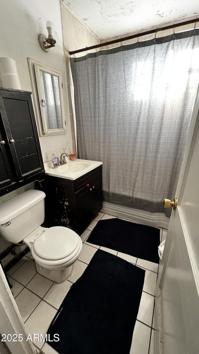 201 E 2nd Ave, Ajo, AZ 85321 - bathroom with toilet, tile patterned flooring, vanity, and a shower with shower curtain