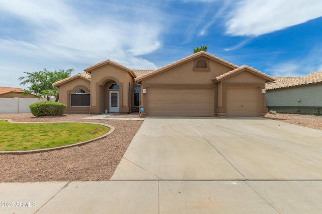 2189 E Ranch Ct, Gilbert, AZ 85296 - mediterranean / spanish-style home featuring an attached garage, stucco siding, concrete driveway, and a tile roof