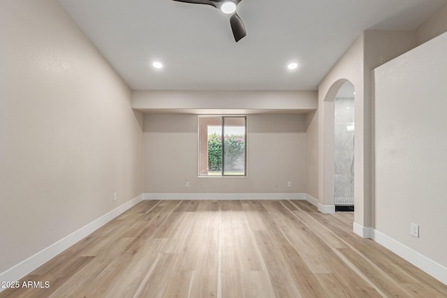 2189 E Ranch Ct, Gilbert, AZ 85296 - empty room featuring light wood-type flooring, ceiling fan, baseboards, arched walkways, and recessed lighting