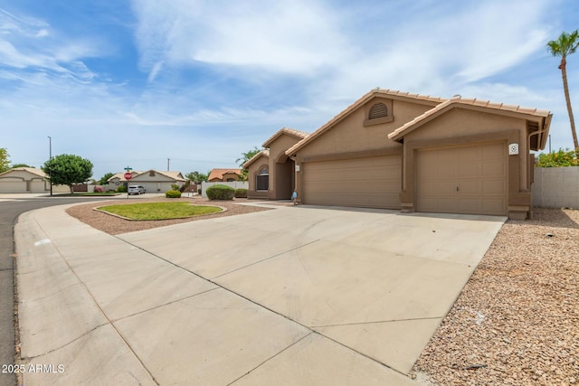 2189 E Ranch Ct, Gilbert, AZ 85296 - view of front of home with stucco siding, an attached garage, driveway, and a tiled roof