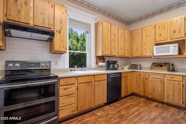 7252 N Central Ave, Phoenix, AZ 85020 - kitchen featuring range with two ovens, dishwasher, under cabinet range hood, a sink, and white microwave