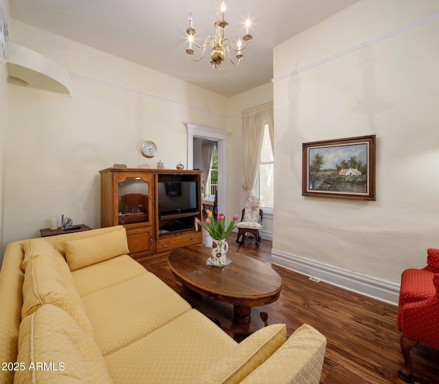 7252 N Central Ave, Phoenix, AZ 85020 - living room with a chandelier, wood finished floors, and baseboards