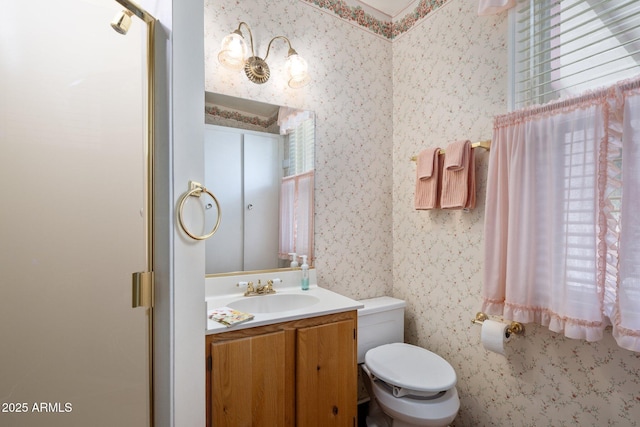 7252 N Central Ave, Phoenix, AZ 85020 - bathroom with wallpapered walls, toilet, vanity, and an enclosed shower