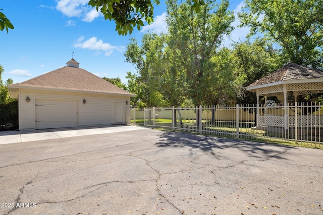 7252 N Central Ave, Phoenix, AZ 85020 - view of home's exterior with a garage, a gazebo, fence, and asphalt driveway