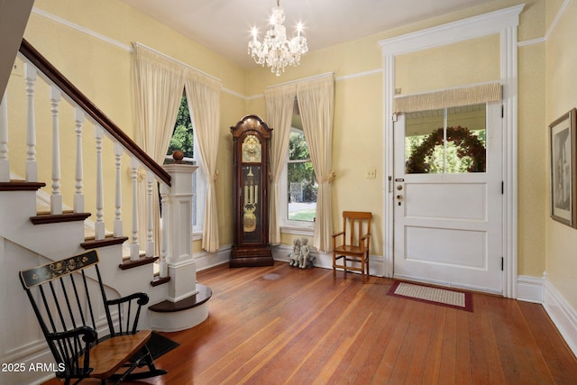 7252 N Central Ave, Phoenix, AZ 85020 - entrance foyer with hardwood / wood-style floors, stairway, a chandelier, and baseboards