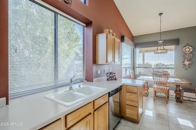 kitchen featuring sink, light tile patterned floors, light brown cabinetry, decorative light fixtures, and stainless steel dishwasher