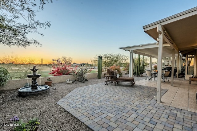 view of patio terrace at dusk