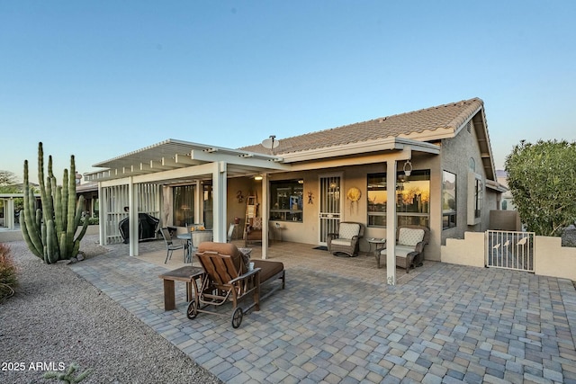 back of property featuring a patio area