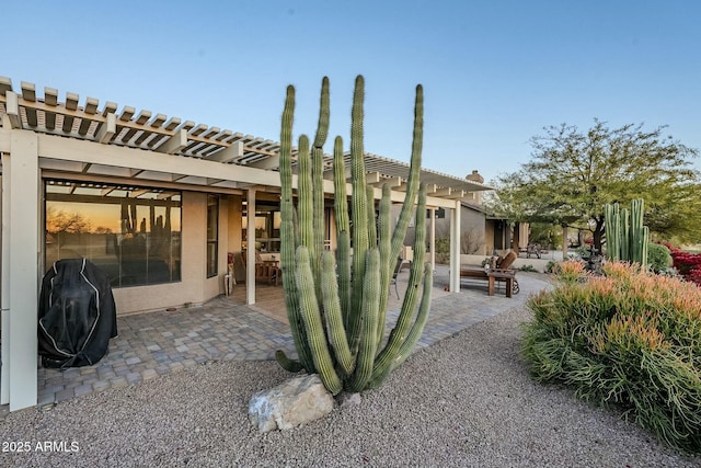 exterior space featuring a patio and a pergola