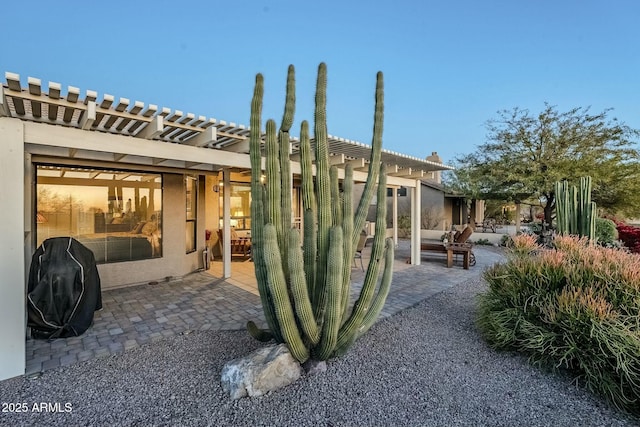 exterior space featuring a pergola and a patio