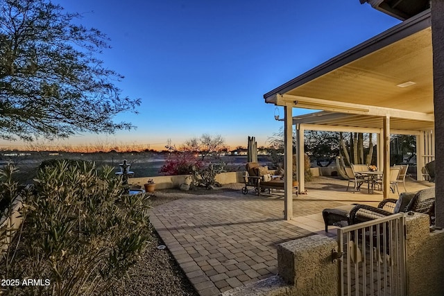 view of patio terrace at dusk