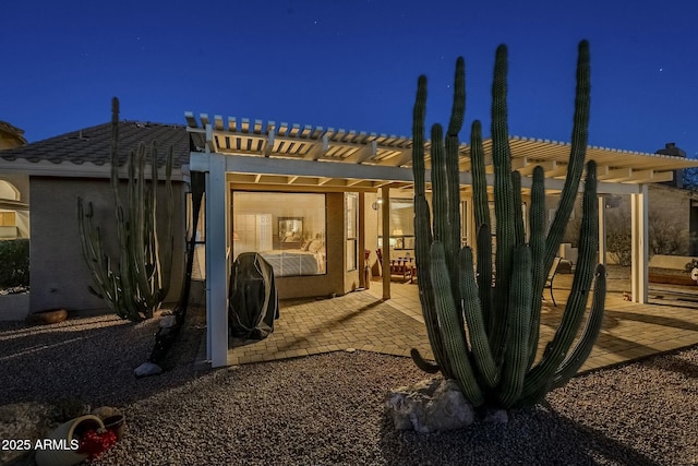 exterior space featuring a pergola and a patio