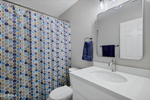 full bathroom featuring vanity, curtained shower, toilet, and visible vents