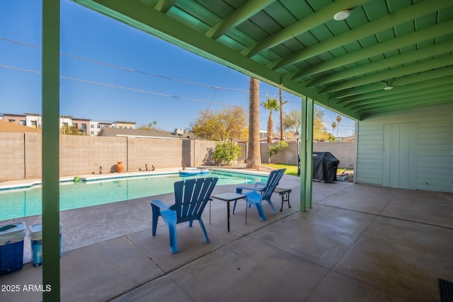 view of patio with a fenced backyard, a fenced in pool, and area for grilling