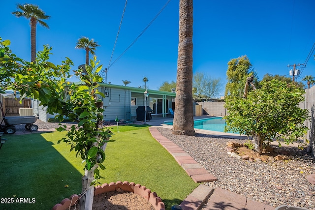 view of yard with a patio, a fenced backyard, and a fenced in pool