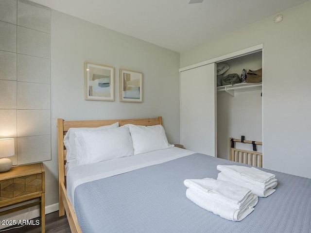 bedroom featuring a closet and wood finished floors