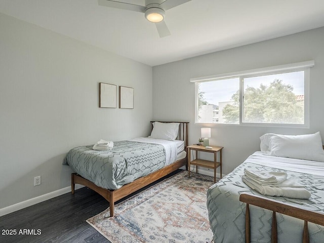 bedroom with wood finished floors, baseboards, and a ceiling fan
