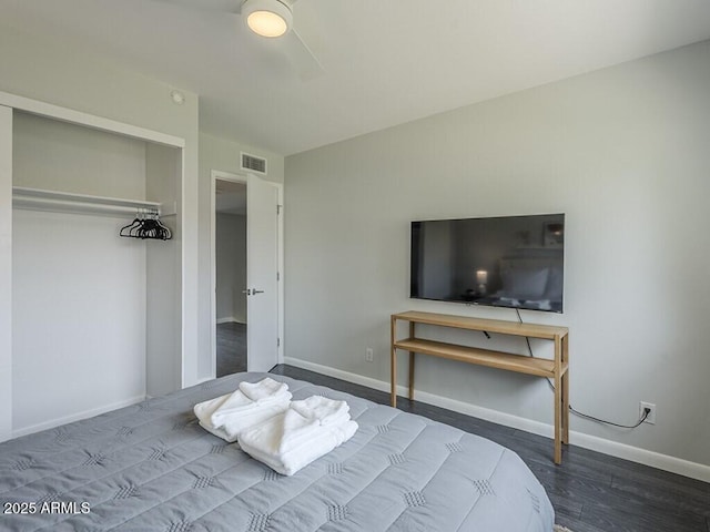 bedroom with baseboards and wood finished floors