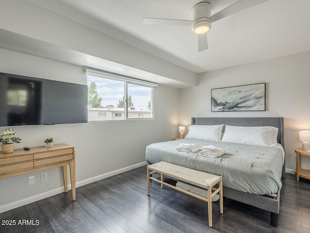 bedroom featuring wood finished floors, baseboards, and a ceiling fan