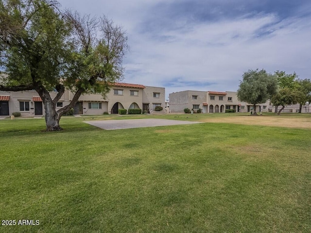 view of front of home featuring a front lawn and stucco siding