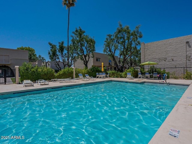 community pool featuring fence