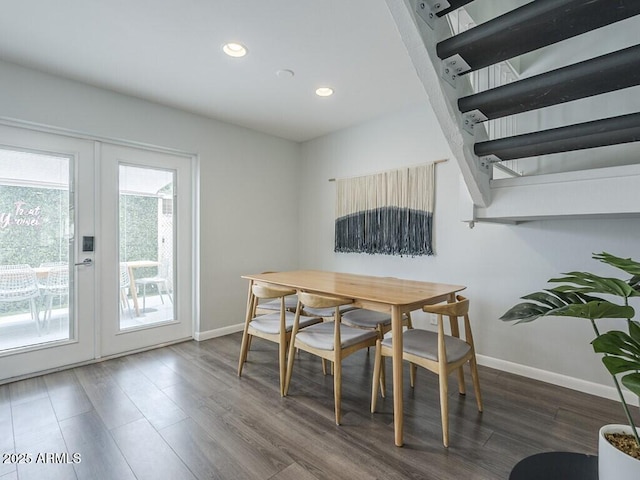 dining space featuring french doors, wood finished floors, baseboards, and recessed lighting