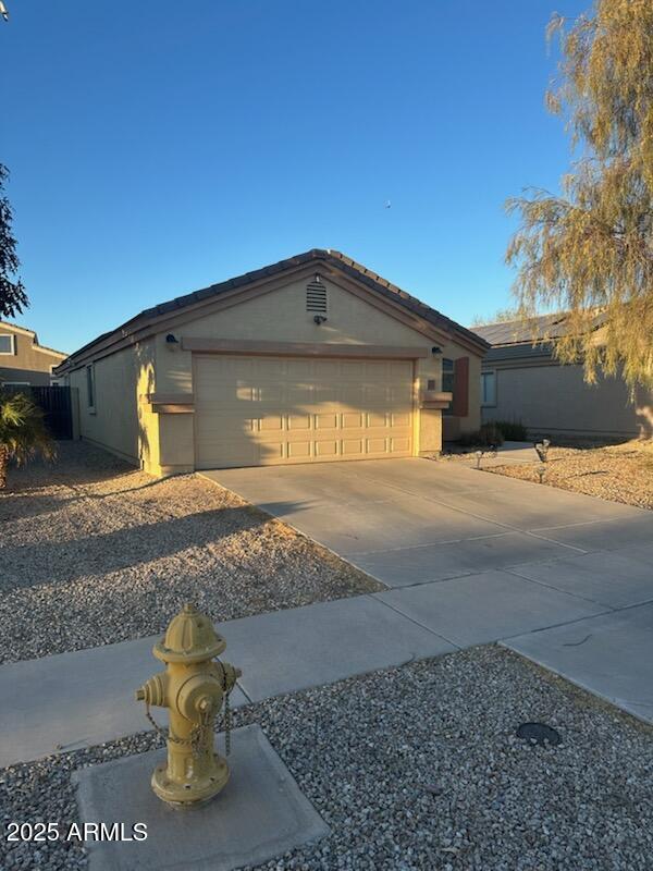 ranch-style house featuring a garage