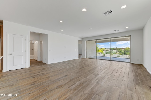 spare room featuring light wood-type flooring