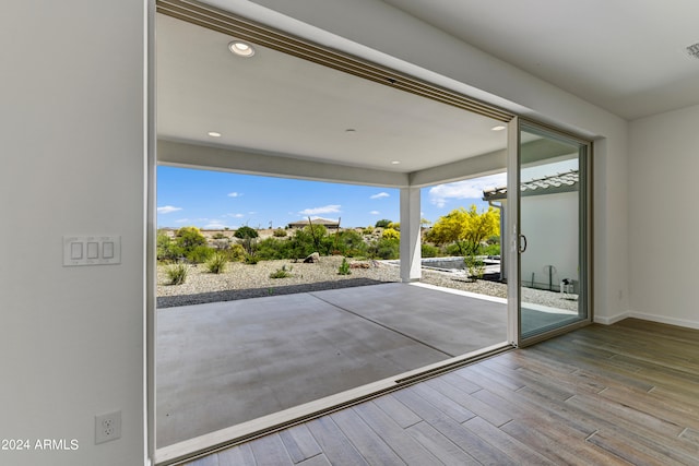 doorway to outside featuring wood-type flooring